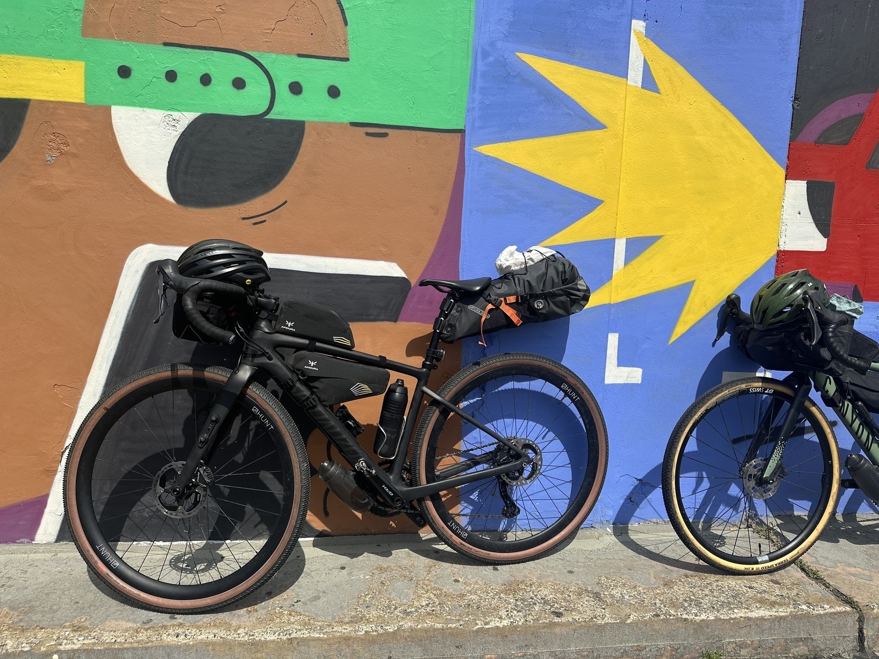 Gravel bike in front of graffiti wall at train station Hanover