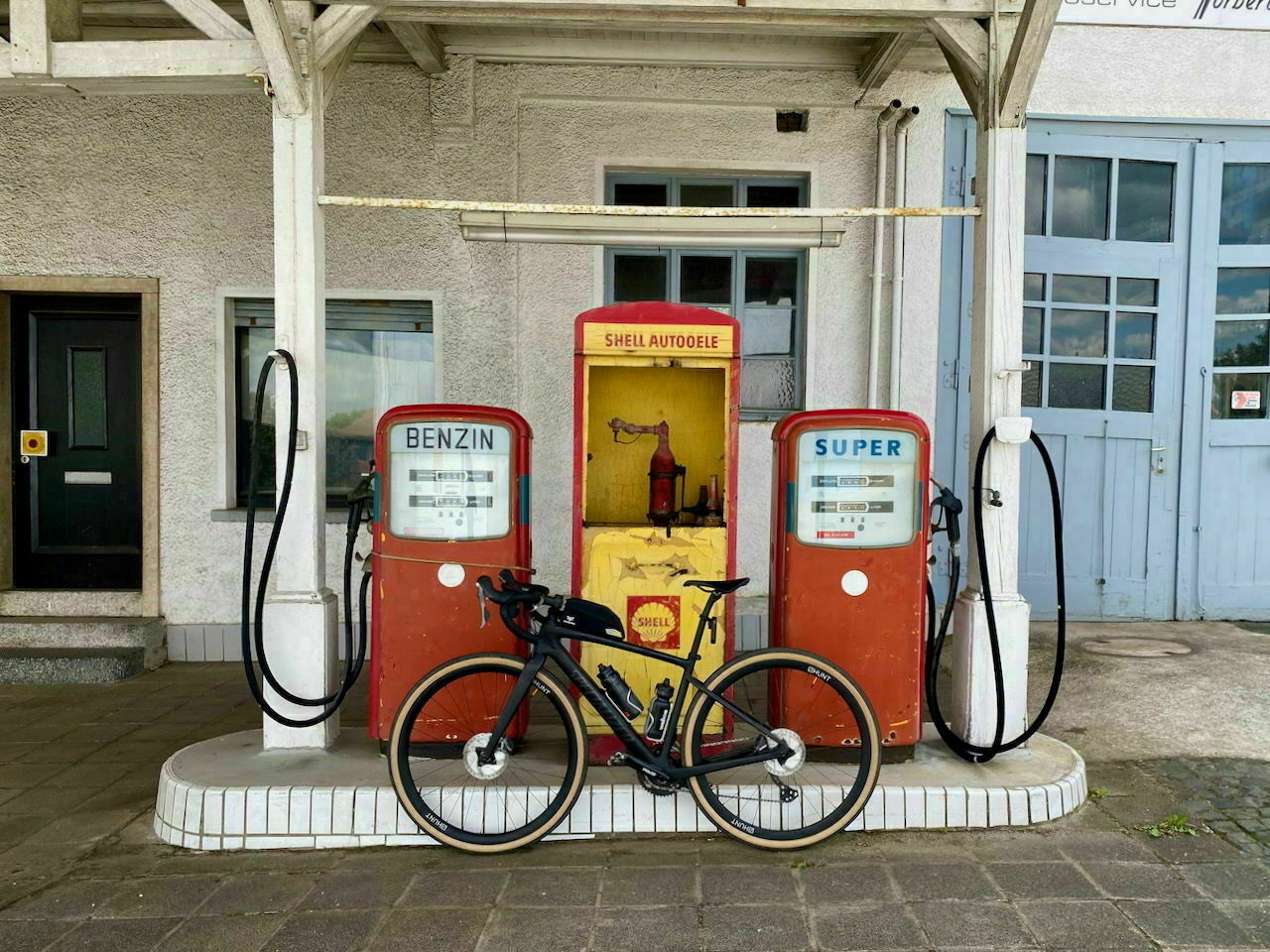 Gravel bike  in front of a former gas station.